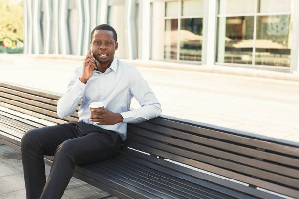 istock Black businessman outdoors in smart casual ware 886491042