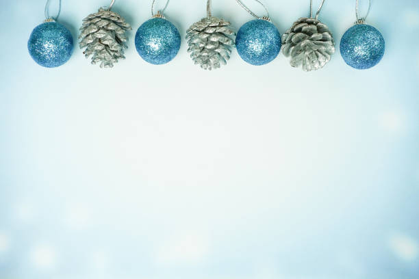 istock Cyan christmas ball and pine cone - Winter background 886494398
