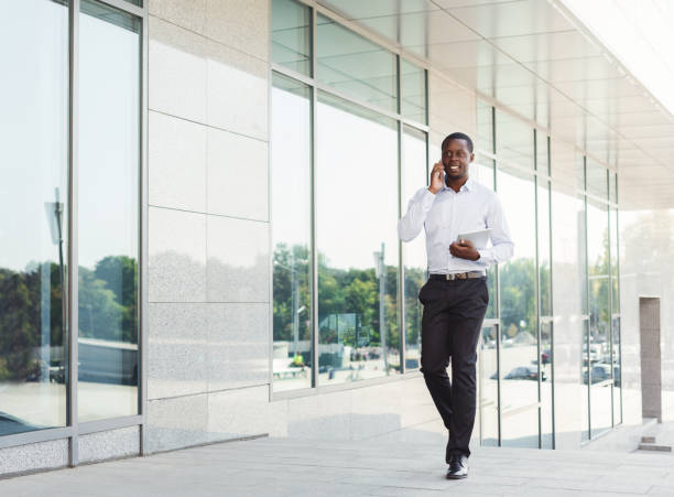 istock Black businessman outdoors in smart casual ware 886494672