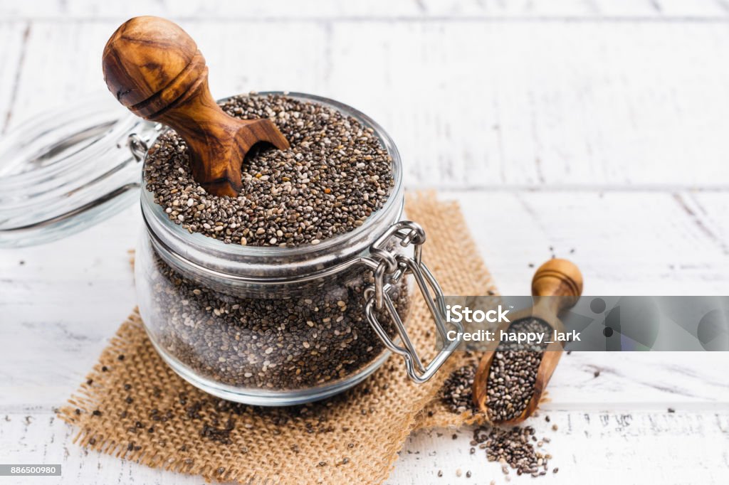 Healthy chia seeds in a glass jar Healthy chia seeds in a glass jar. Healthy eating concept. Copy space Chia seed Stock Photo