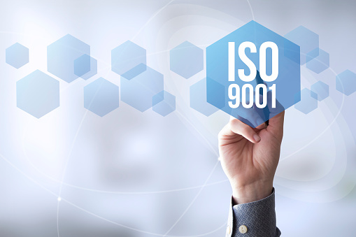 hand touching a touch screen interface with iso 9001
