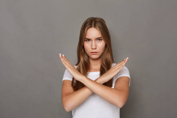 istock Woman making stop sign with crossed hands 886503828