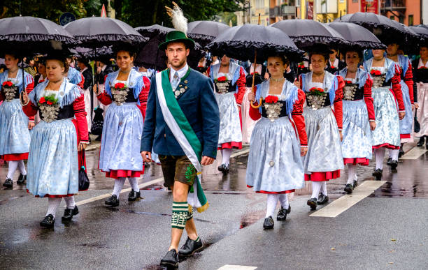 Munich, Germany - September 18, 2016: Opening parade at the Oktoberfest in Munich. The Oktoberfest is the world biggest beer festival and at the opening parade with rd. 9000 participants take part in historical costumes, music bands and horses. The photo was made in front of the entrance of the Maximilianeum, where the parade starts und shows politicans, brass bands, and people with traditional costumes.