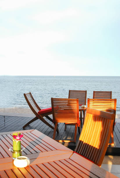 istock wood table and chair on the beach 886507448