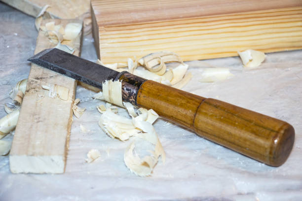 istock Chisel on the table among the shavings 886507804