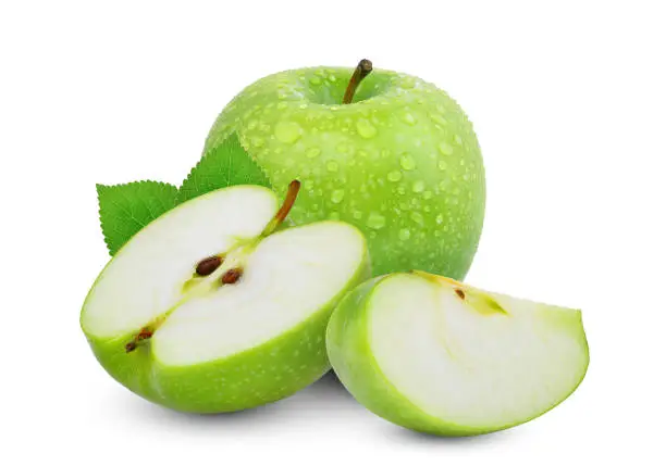 Photo of whole and hafl with slice of green apple or granny smith apple with green leaves isloated on white background