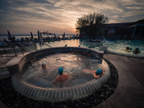 Aquaria is the Thermal Spa Center of Terme di Sirmione. A unique place, surrounded by the beautiful setting of Lake Garda. Sirmione, Italy - August 3, 2016: Aquaria is the Thermal Spa Center of Terme di Sirmione. A unique place, surrounded by the beautiful setting of Lake Garda. italian lake district photos stock pictures, royalty-free photos & images