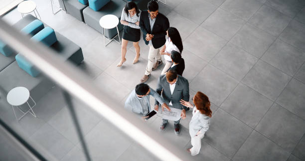 istock Corporate teamworking colleagues in modern office 886514750