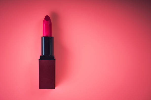 istock cosmetic red lipstick on pink 886514780