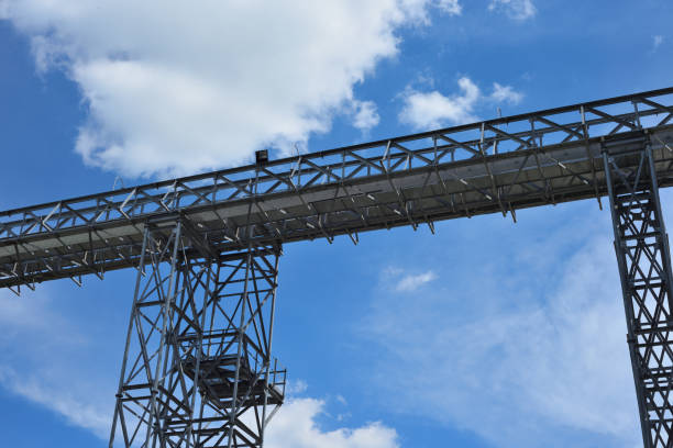 istock Fragment of metal grain elevator in facility with silos. 886520790