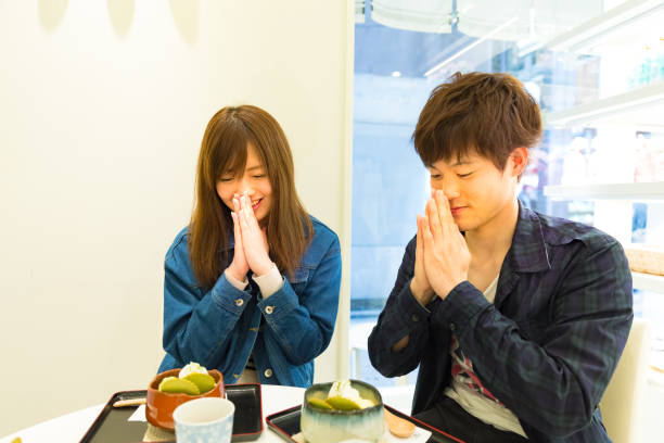istock Smiling young couple eating dessert 886521190
