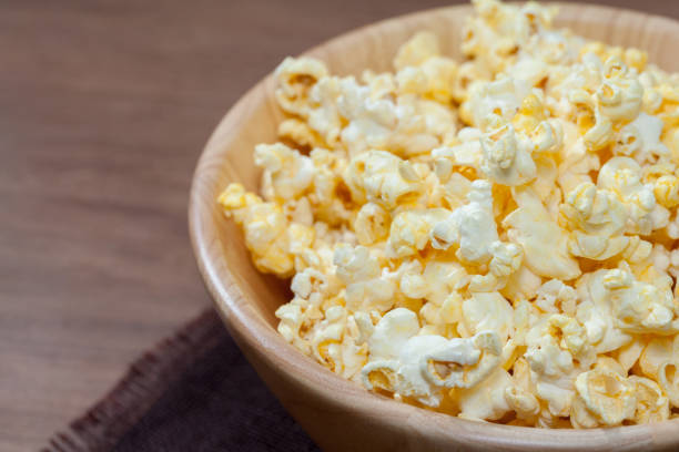 istock popcorn in wooden bowl 886525770