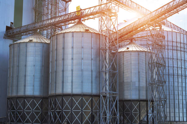 istock Agricultural Silos. Metal grain facility with silos. 886525942