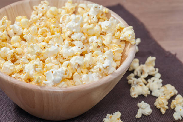istock popcorn in wooden bowl 886528940