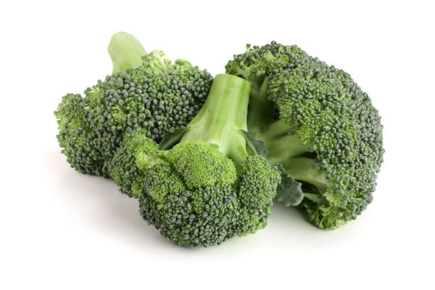 istock fresh broccoli isolated on white background close-up. Top view 886530774