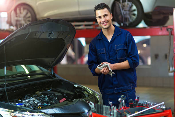 istock Mechanic working on car in auto repair shop 886550036