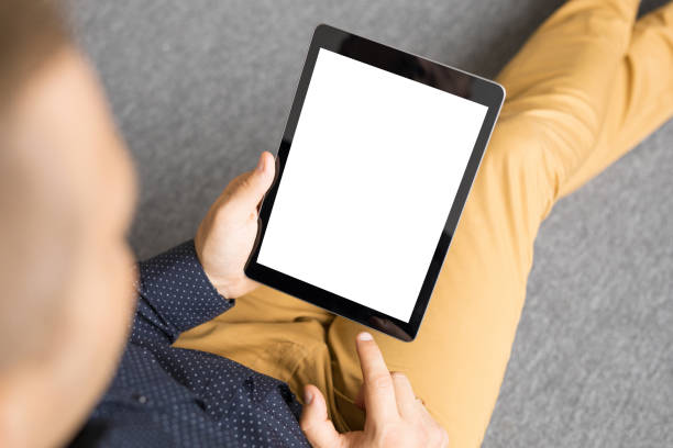 istock Man holding tablet in vertical position. 886550380