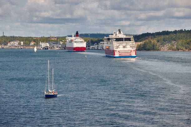 Cruise vessels and sailboat on the baltic sea. Aland Cruise vessels and sailboat on the baltic sea. Aland islands åland islands stock pictures, royalty-free photos & images