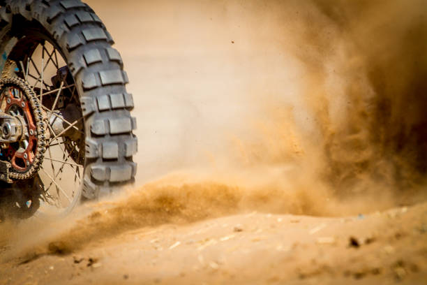 istock Dirt Bike splashing sand 886553162