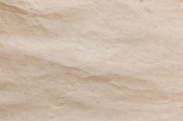 istock Brown kraft paper texture. Grunge recycled background. 886553320