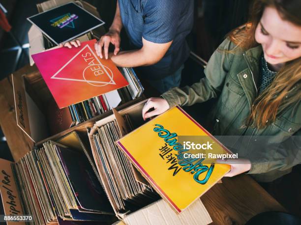 Young People In A Record Shop Stock Photo - Download Image Now - Record - Analog Audio, Record Store, Store