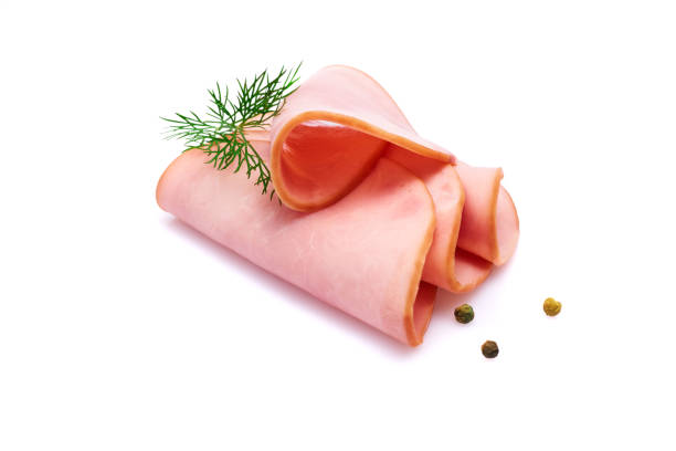 Rolled bologna slices isolated on white background with herbs and spices Cooked boiled ham sausage or rolled bologna slices isolated on white background with herbs and spices baloney photos stock pictures, royalty-free photos & images