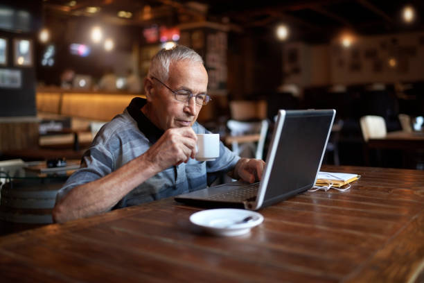 istock Senior man in coffee shop 886557796