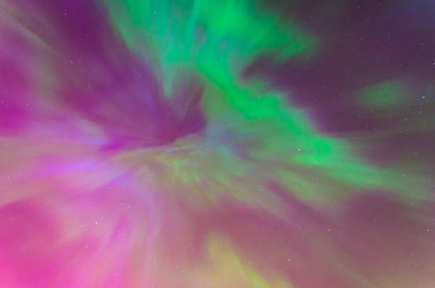 istock Polar lights Aurora Borealis in the night starry sky, texture and multi-colored natural phenomena. 886558112