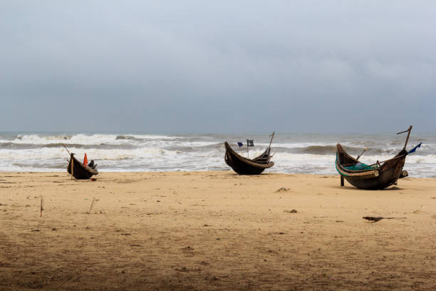 istock Some of bamboo boat on the sand in storm 886560754