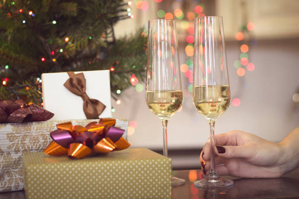 istock Still life with two glasses of champaign and gift boxes 886561176