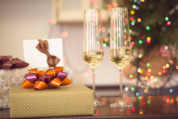 istock Still life with two glasses of champaign and gift boxes 886561254