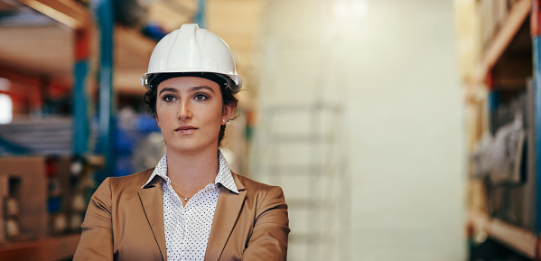 Cropped shot of an attractive young female stock controller standing in a warehouse