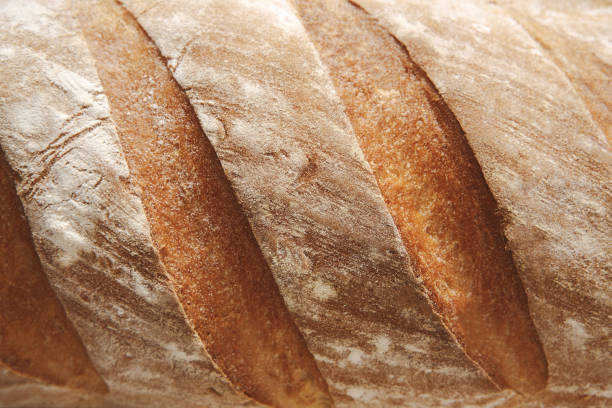 istock Bread texture background, closeup of baguette loaf 886574566