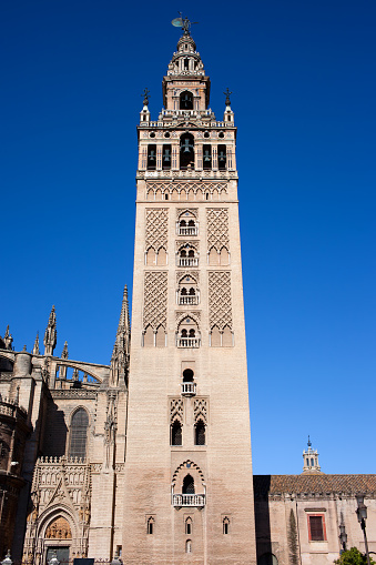 La Giralda, bell tower of the Seville Cathedral in Spain, Almohad and Renaissance architectural styles.