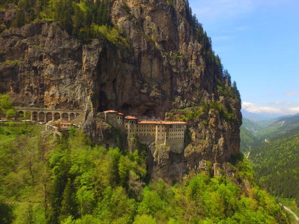 Sumela Monastery Drone view of Sumela (Virgin Mary) Monastery built on the rocky mountains of Trabzon sumela monastery stock pictures, royalty-free photos & images