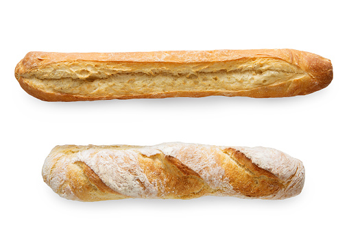 Two french crusty baguettes isolated at white background. Flat lay, top view