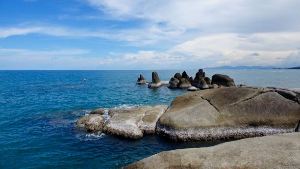 istock Coast landscape view over rocks at the water and ocean 886582250