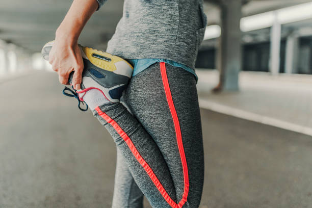 istock Mature woman stretching during a jog 886582664