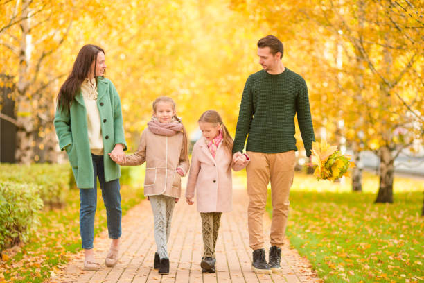 istock Family in autumn park in fall 886582756