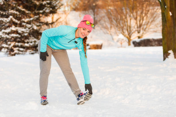 Girl staying in shape in winter, maintainig weight and curves during winter time. Fitness health fashion nature concept