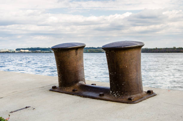 istock Close up of Big Rusty Bollards on a Dock 886600378