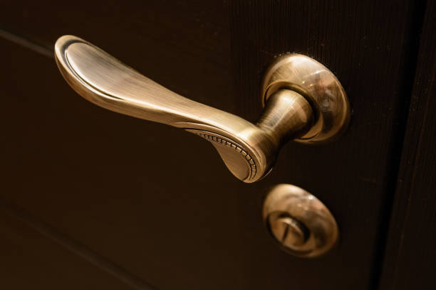 istock Closeup of metal bronze doorhandle 886600600