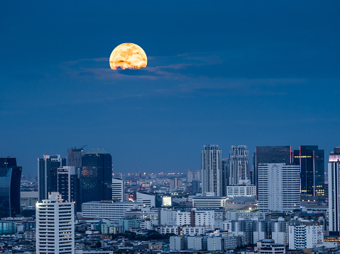 The shiny moonlight from the giant moon of supermoon phenomenon in capital city of Thailand, Bangkok.