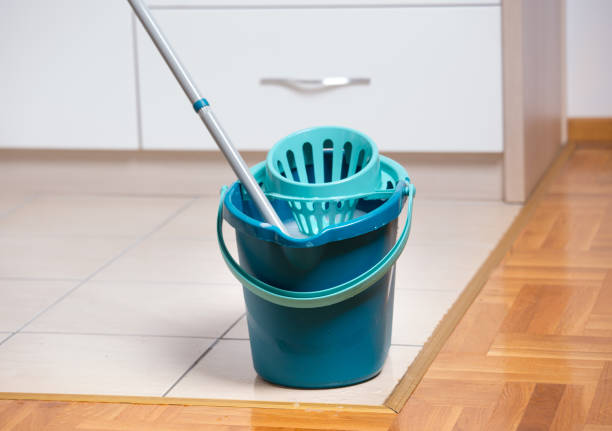 istock Mop and bucket on tiled floor 886600870