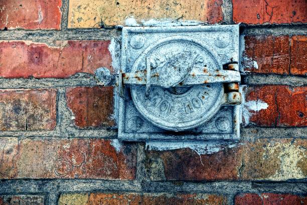 istock old iron heating cover on a brick wall 886613500
