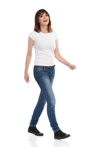istock Happy Young Woman Is Walking, Looking At Camera And Laughing 886619848