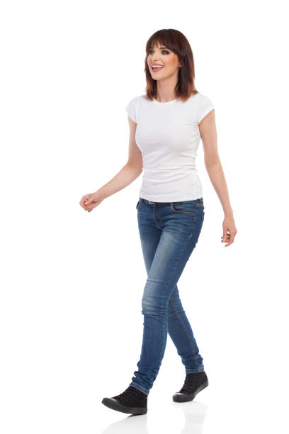 istock Happy Young Woman Is Walking, Looking Away And Talking 886619852