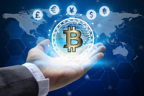 istock hand holding global network using Currencies sign symbol interface of Bitcoin Fintech, virtual currency blockchain technology concept, Investment Financial Technology Concept. 886624588
