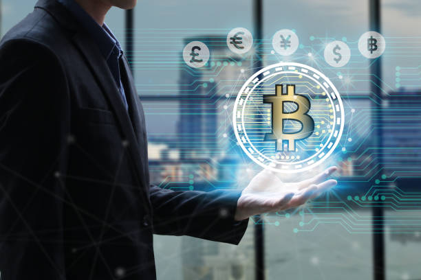 istock Businessman hand holding global network using Currencies sign symbol interface of Bitcoin Fintech, virtual currency blockchain technology concept, Investment Financial Technology Concept 886624772