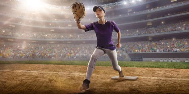istock Softball female player on a professional arena 886630310